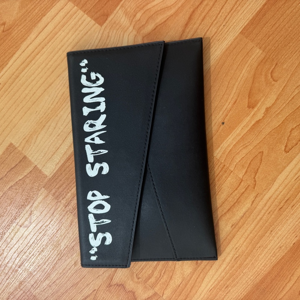 Black and White Clutch on chain with White Text “Stop Staring”